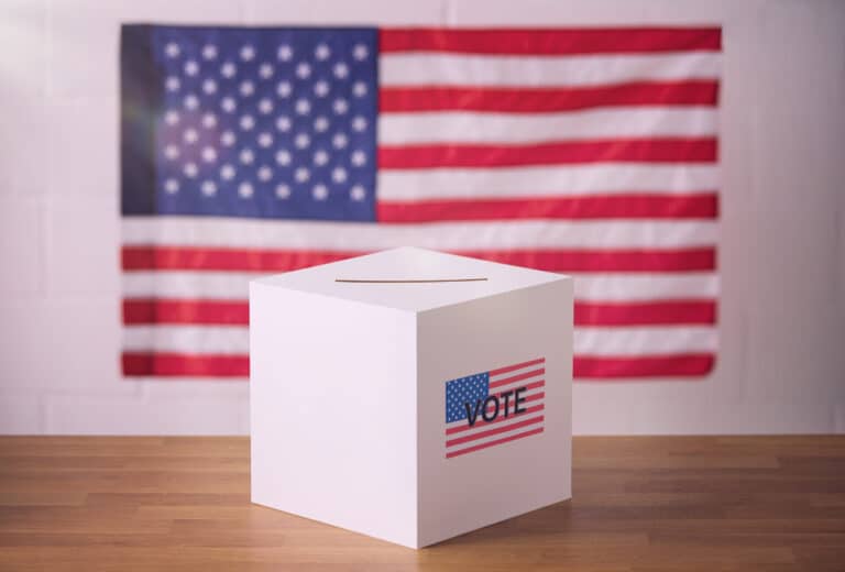 white-ballot-box-with-american-flag-in-background-2024-10-19-02-04-37-utc (1)