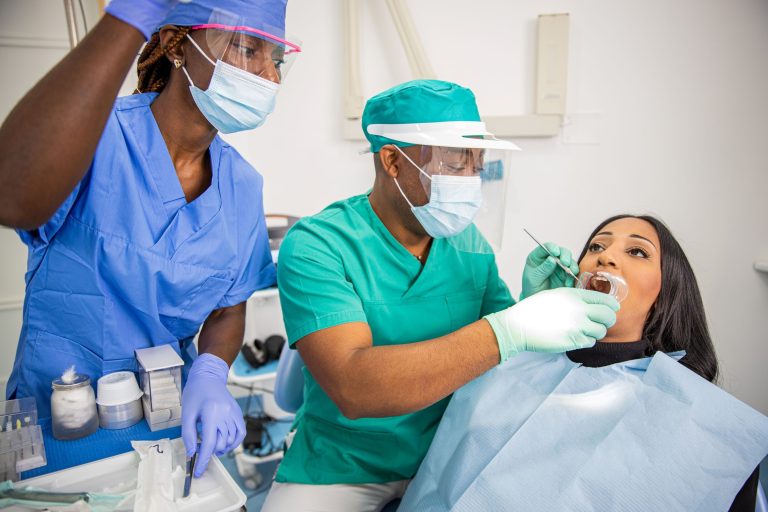 a-dentist-checks-a-patient-s-teeth-in-an-african-d-2025-03-09-11-49-38-utc (1)