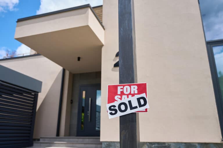 Sign for house is sold with sticker already sold